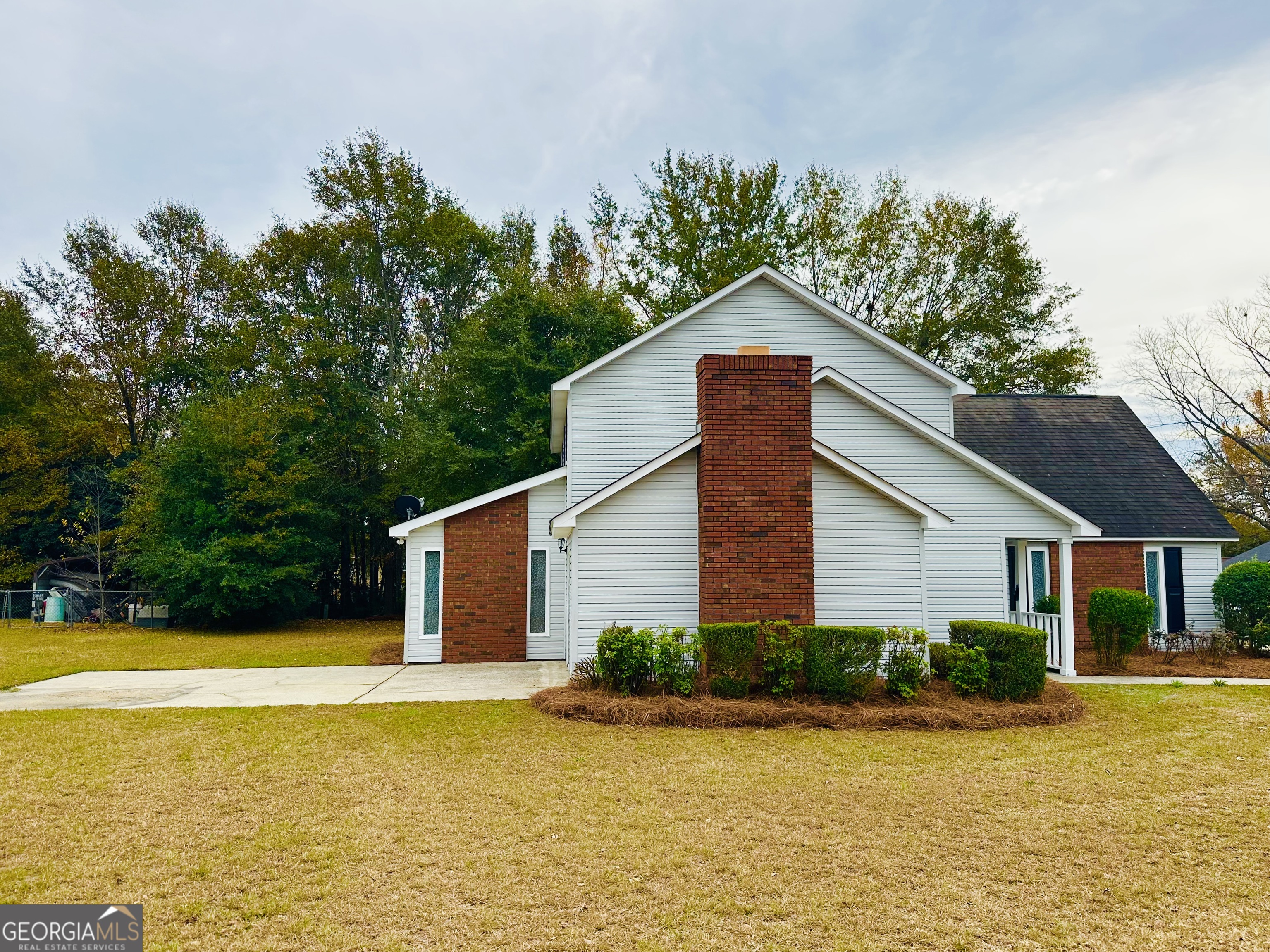 1610 Lance Drive Dublin, GA 31021 - Photo 5 of 38 a view of a house with pool and a yard