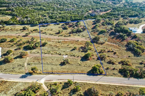 a swimming pool with outdoor seating and garden