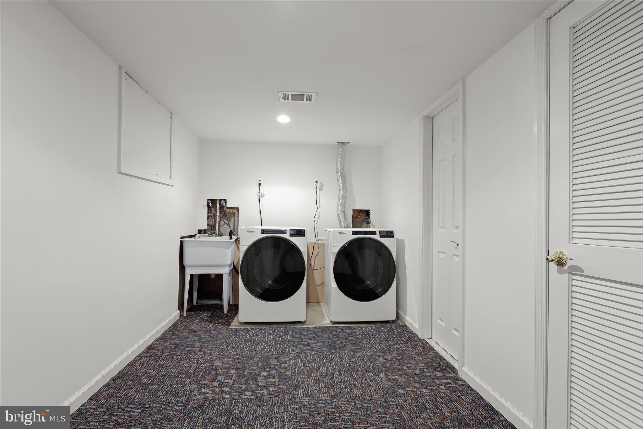 17 Woonsockett Court Silver Spring, MD 20905 - Photo 42 of 54 Lower Level Laundry