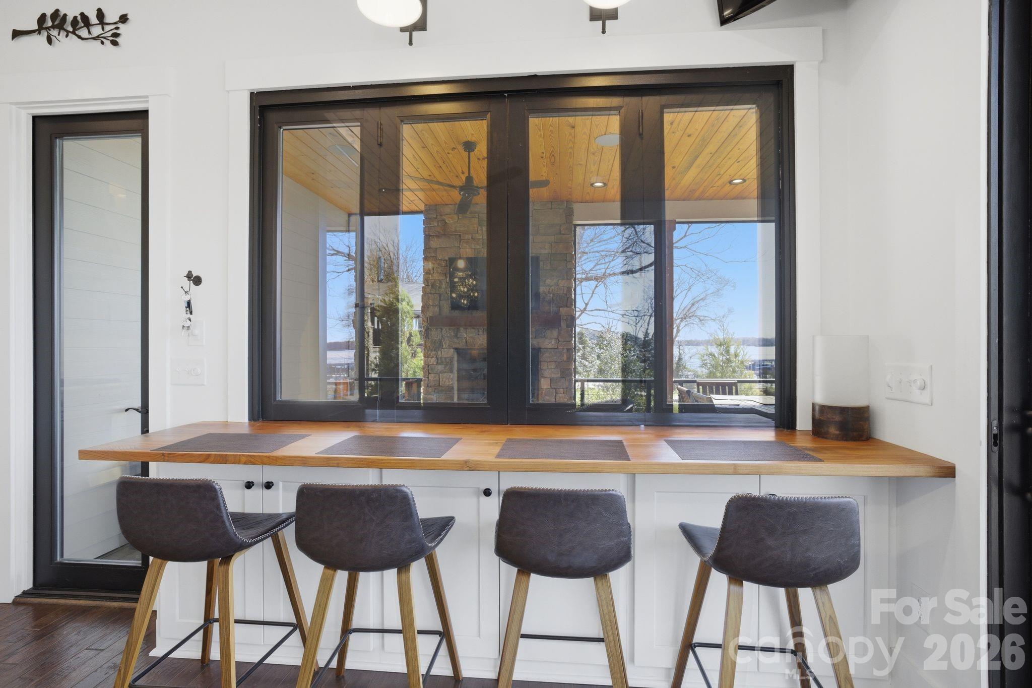 7748 Harbor Lane Denver, NC 28037 - Photo 14 of 42 a dining room with furniture and large windows