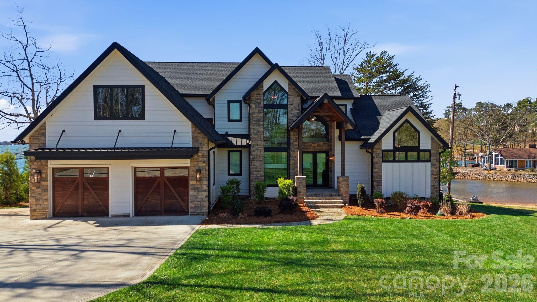 7748 Harbor Lane Denver, NC 28037 - Photo 2 of 42 a view of house with yard and entertaining space