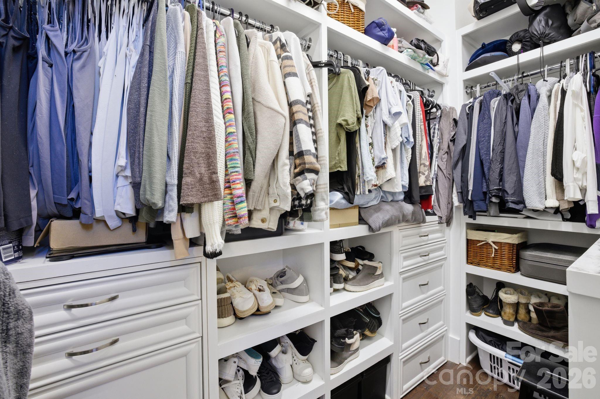 7748 Harbor Lane Denver, NC 28037 - Photo 24 of 42 a view of walk in closet with clothes and shoes