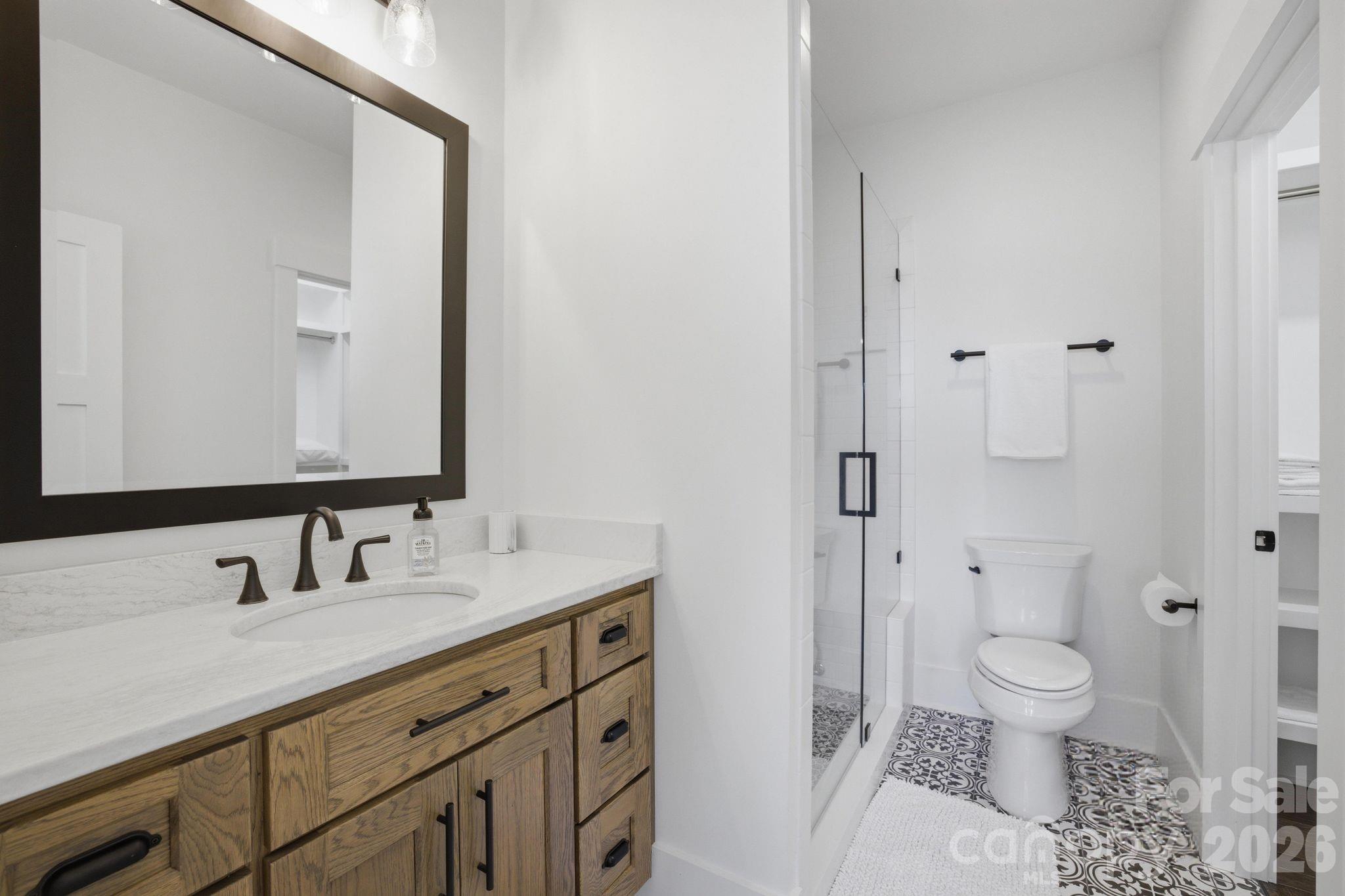 7748 Harbor Lane Denver, NC 28037 - Photo 35 of 42 a bathroom with a sink toilet and shower