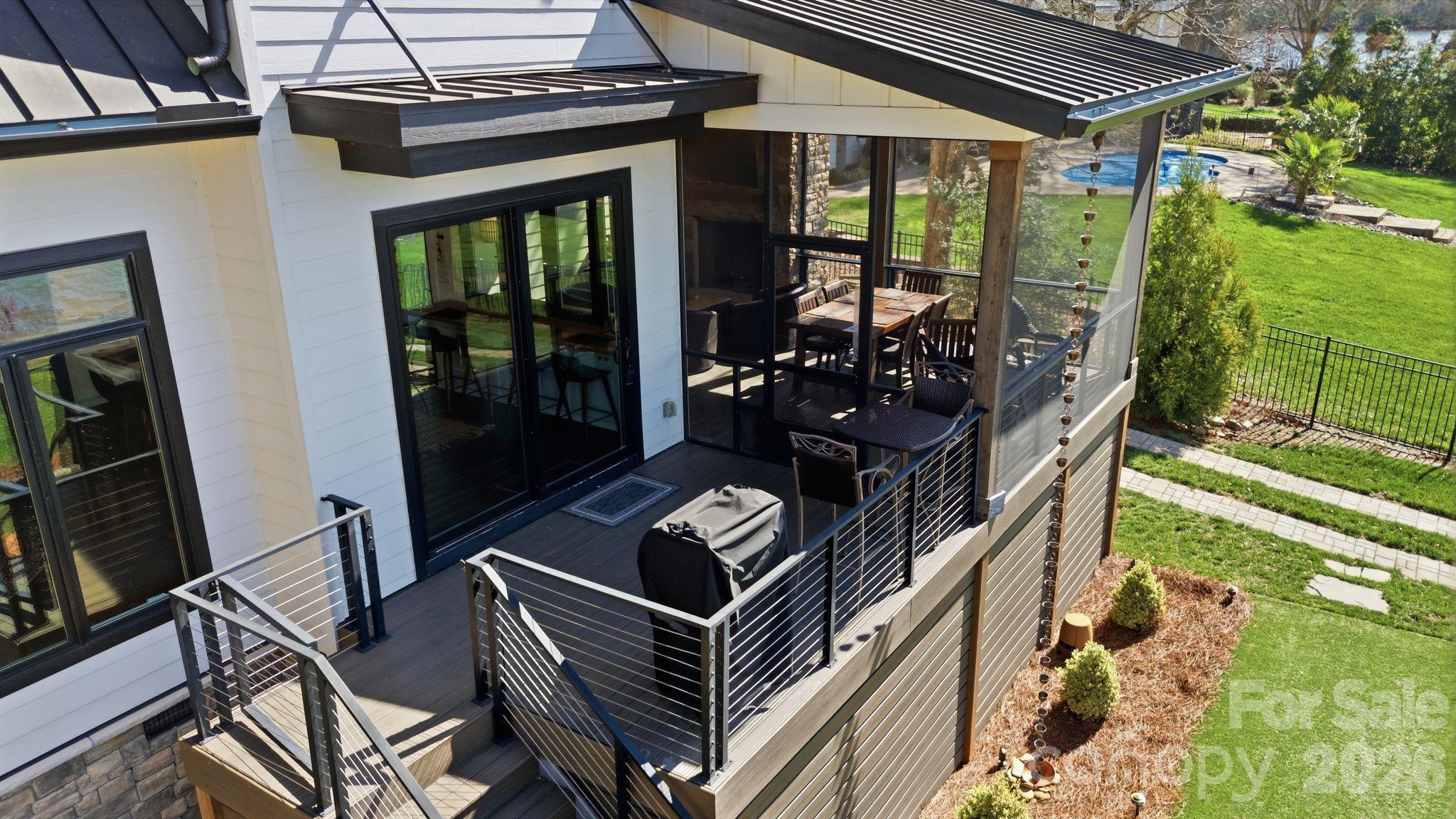 7748 Harbor Lane Denver, NC 28037 - Photo 41 of 42 a view of backyard with deck and outdoor seating