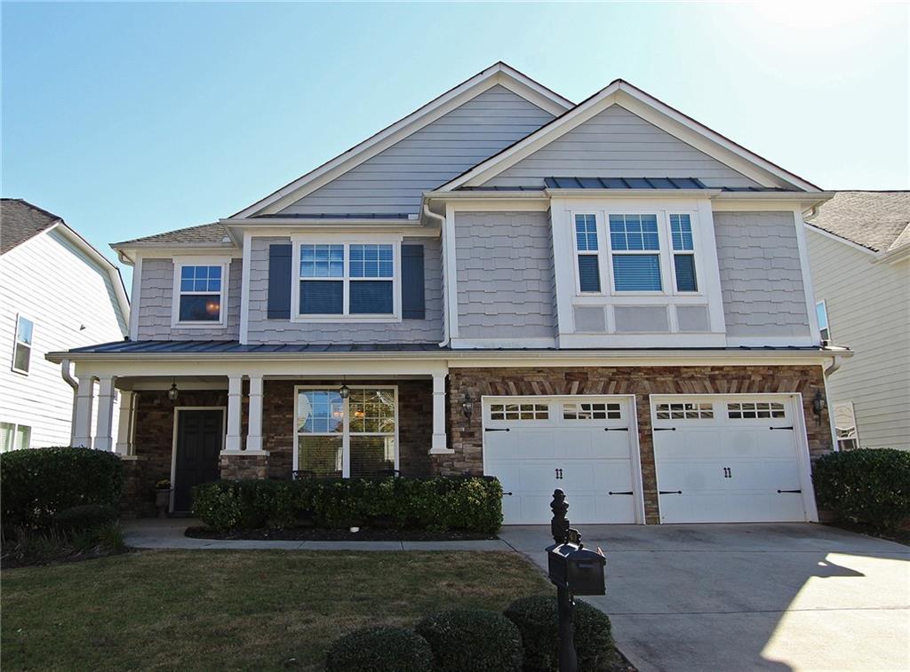 5870 Beaver Ridge Drive Cumming, GA 30040 - Photo 1 of 1 a front view of a house with a yard
