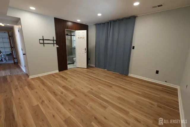 a view of a livingroom with wooden floor