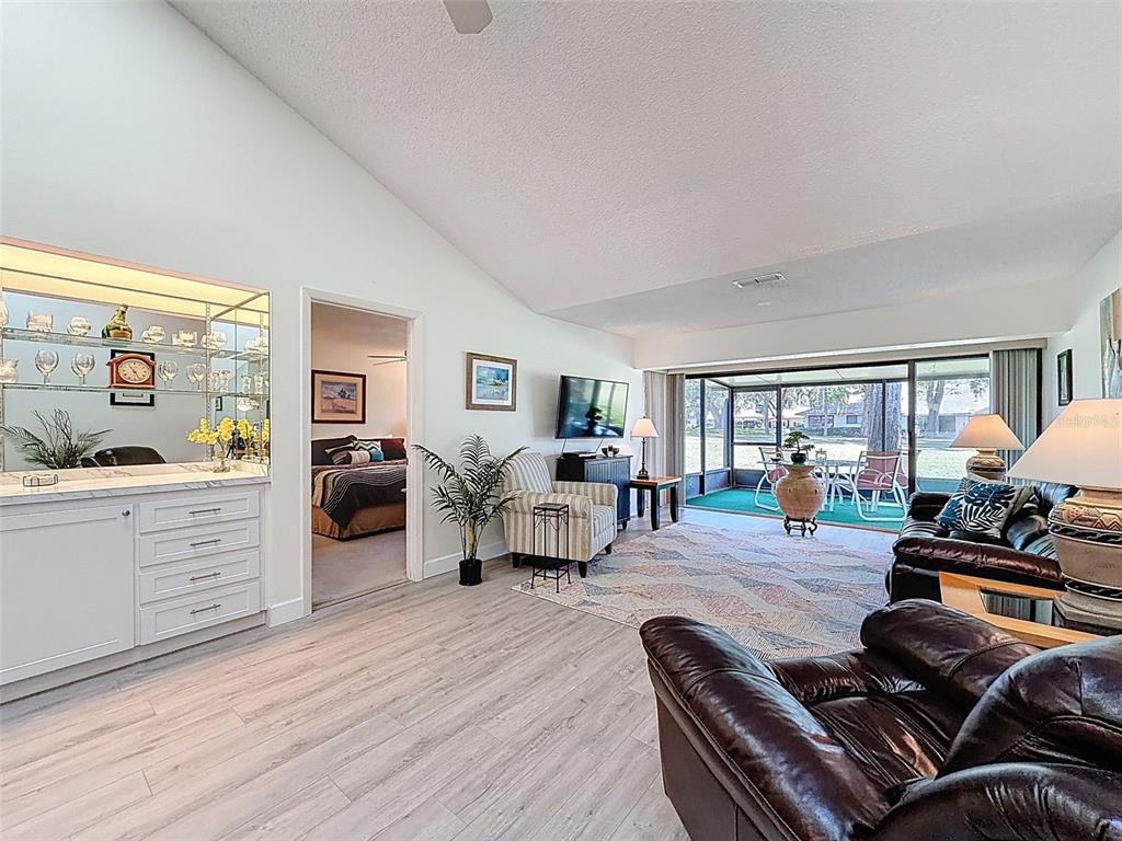 3504 Niblick Court, Unit 4 New Port Richey, FL 34655 - Photo 20 of 58 a living room with furniture and a large window