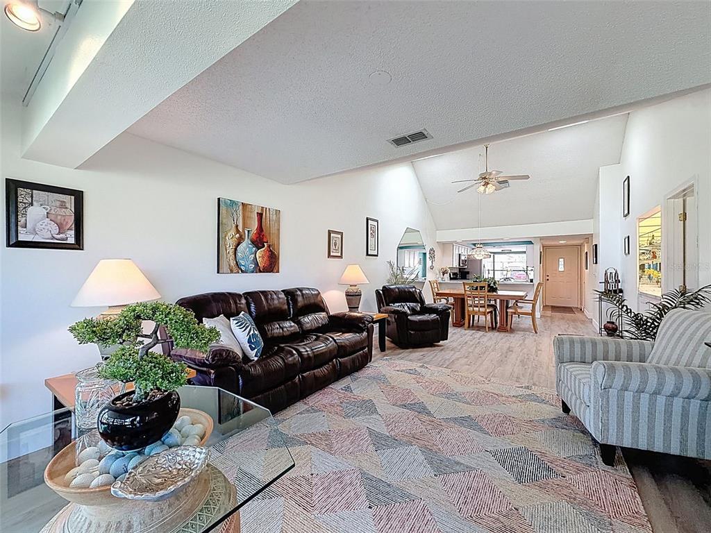 3504 Niblick Court, Unit 4 New Port Richey, FL 34655 - Photo 21 of 58 a living room with furniture and a potted plant
