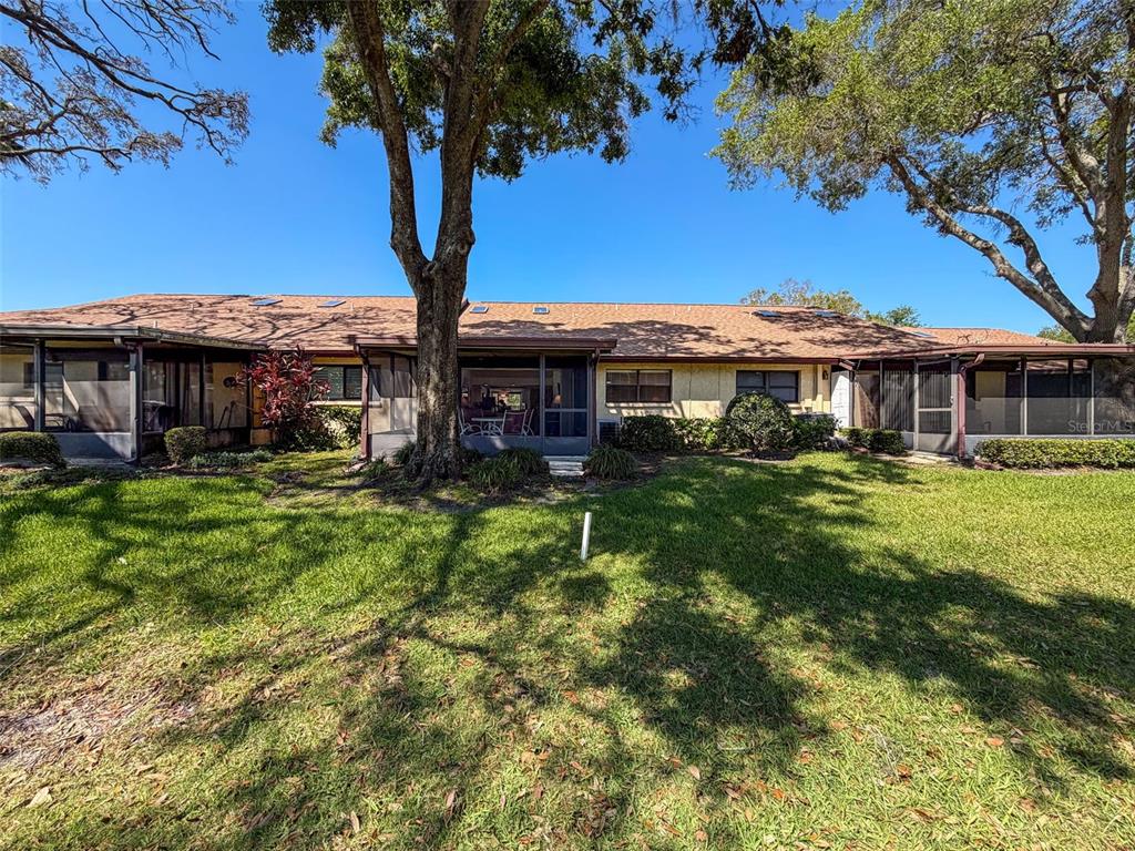 3504 Niblick Court, Unit 4 New Port Richey, FL 34655 - Photo 28 of 58 a front view of a house with garden