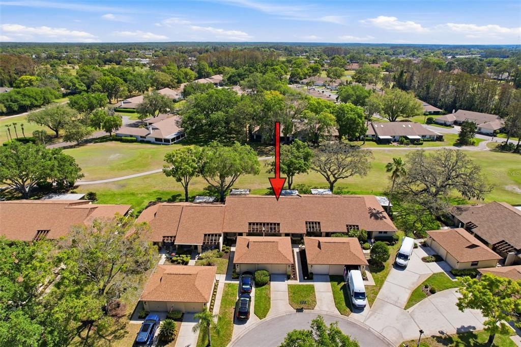 3504 Niblick Court, Unit 4 New Port Richey, FL 34655 - Photo 3 of 58 an aerial view of residential houses with outdoor space and street view