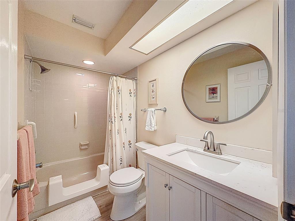 3504 Niblick Court, Unit 4 New Port Richey, FL 34655 - Photo 41 of 58 a bathroom with a sink a toilet and a mirror