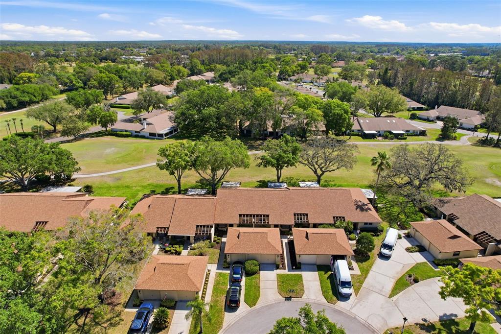 3504 Niblick Court, Unit 4 New Port Richey, FL 34655 - Photo 44 of 58 an aerial view of residential houses with outdoor space and street view