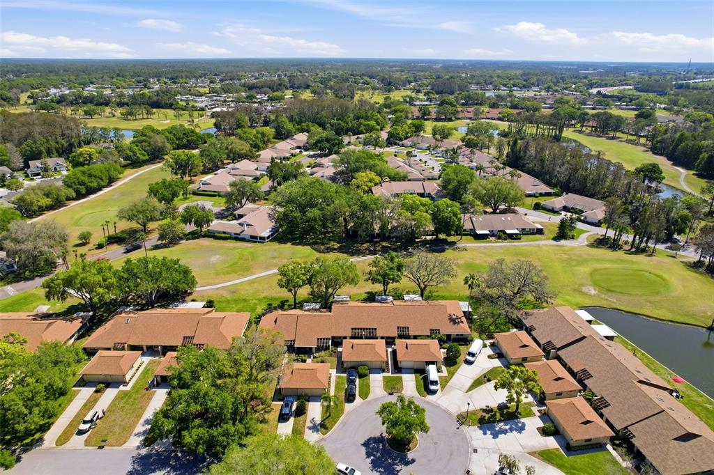 3504 Niblick Court, Unit 4 New Port Richey, FL 34655 - Photo 47 of 58 an aerial view of residential houses with outdoor space