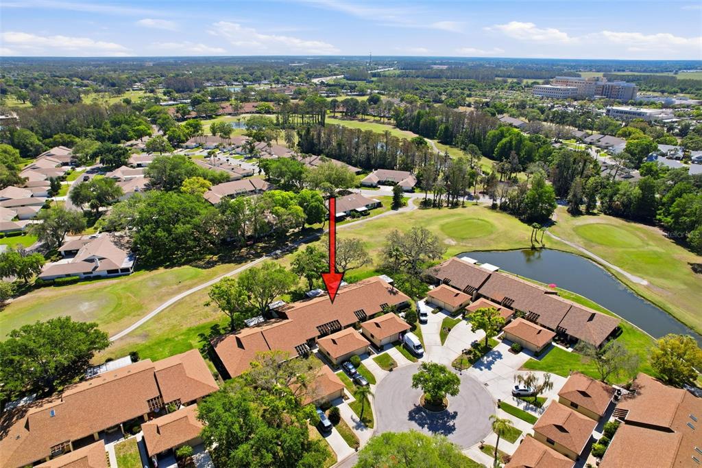 3504 Niblick Court, Unit 4 New Port Richey, FL 34655 - Photo 48 of 58 an aerial view of residential houses with outdoor space