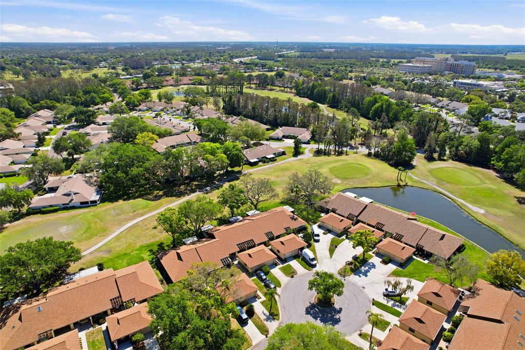 3504 Niblick Court, Unit 4 New Port Richey, FL 34655 - Photo 49 of 58 an aerial view of residential houses with outdoor space