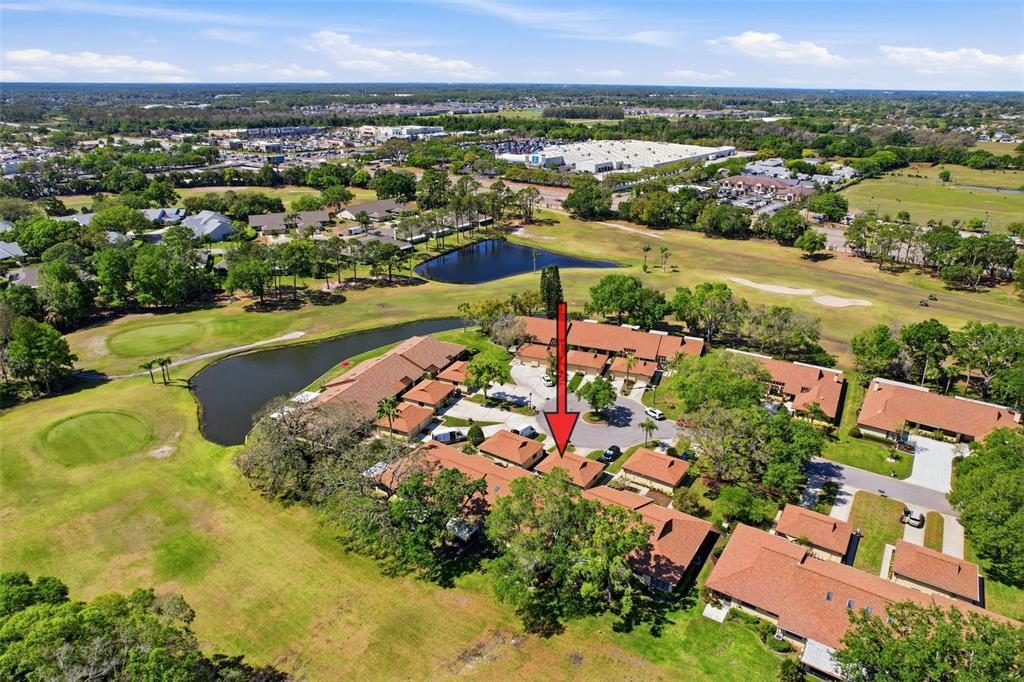 3504 Niblick Court, Unit 4 New Port Richey, FL 34655 - Photo 50 of 58 an aerial view of residential houses with outdoor space