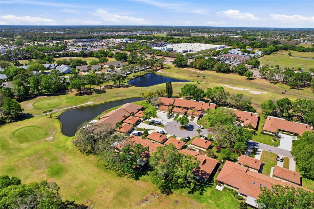 3504 Niblick Court, Unit 4 New Port Richey, FL 34655 - Photo 51 of 58 an aerial view of residential houses with outdoor space