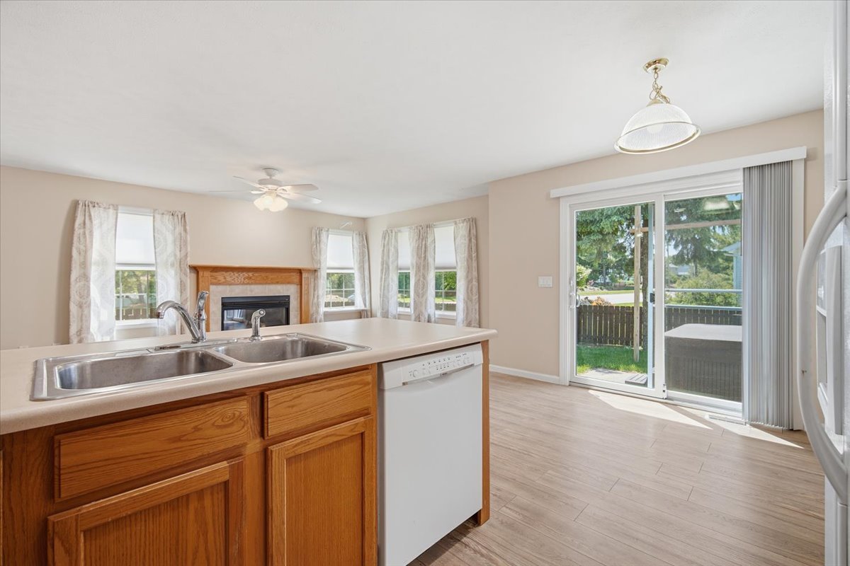 311 Old Farm Road Bloomington, IL 61704 - Photo 13 of 34 a kitchen with a sink and a large window