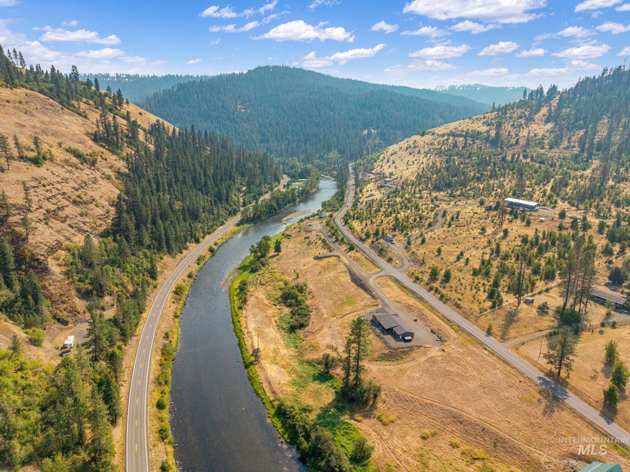 2136 Lukes Gulch Road Stites, ID 83552 - Photo 5 of 50 Riverfront property with direct road frontage, surrounded by rolling hills and dense tree coverage