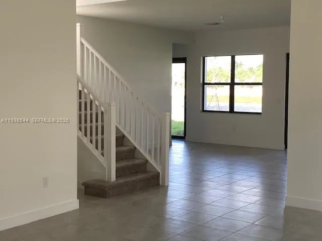 an entryway in a hall with a window