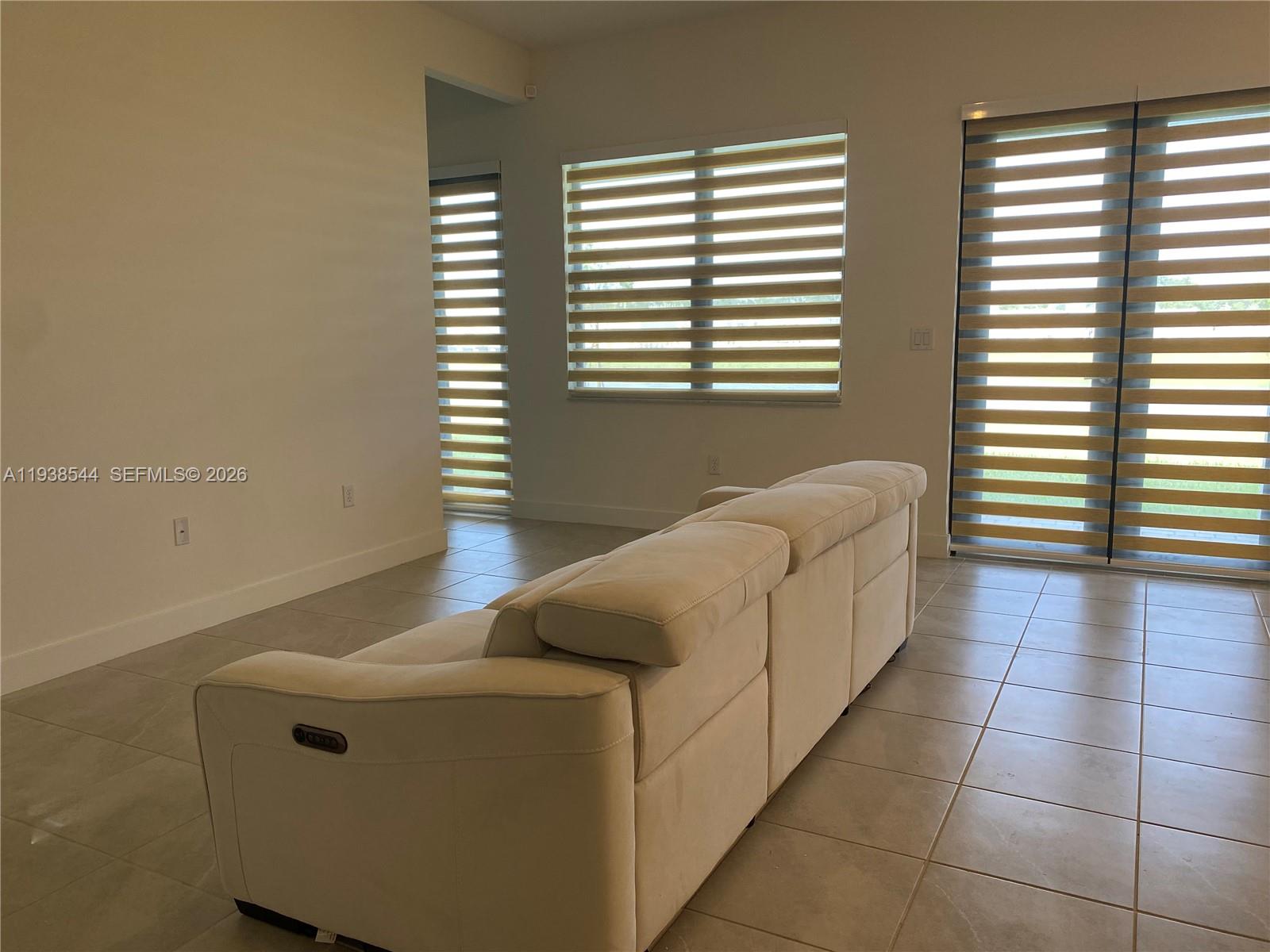4435 Southwest 174th Avenue Miramar, FL 33029 - Photo 17 of 34 a living room with furniture and a window