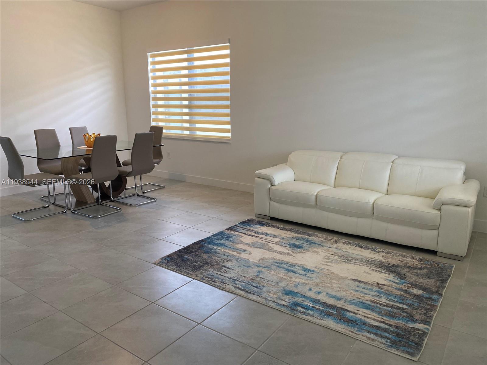 4435 Southwest 174th Avenue Miramar, FL 33029 - Photo 18 of 34 a living room with furniture and a window