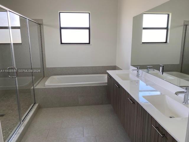 4435 Southwest 174th Avenue Miramar, FL 33029 - Photo 20 of 34 a spacious bathroom with a tub sink and mirror