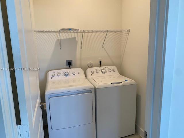 4435 Southwest 174th Avenue Miramar, FL 33029 - Photo 27 of 34 a utility room with dryer and washer