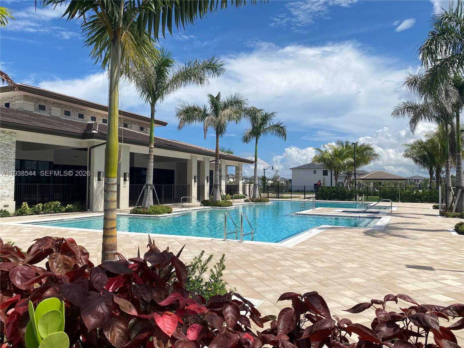 4435 Southwest 174th Avenue Miramar, FL 33029 - Photo 34 of 34 front view of a house with a swimming pool