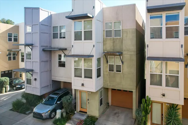 a front view of a building with a yard