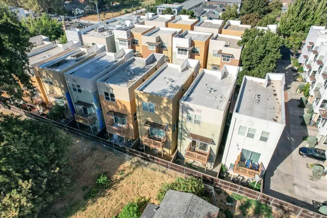 an aerial view of a house with a yard