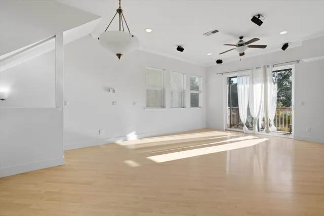 a kitchen with stainless steel appliances white cabinets a stove top oven