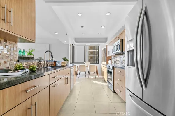 a view of a dining room with furniture and window