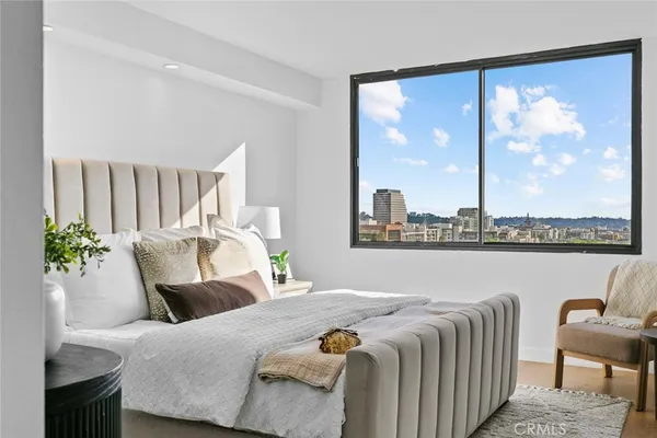 an aerial view of residential houses with city view