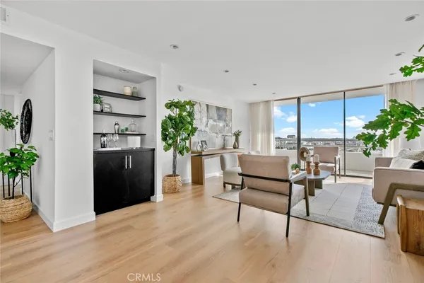 a view of kitchen with furniture and a potted plant