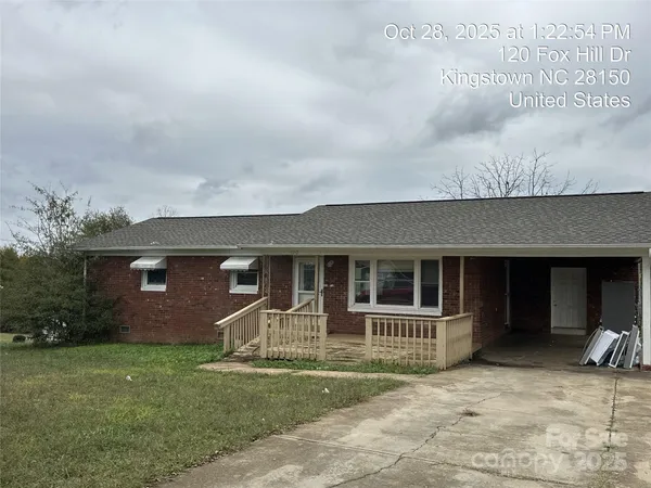 a view of house with yard and entertaining space