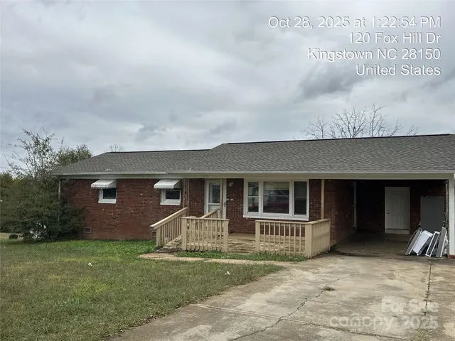 a view of house with yard and entertaining space