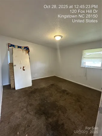 a view of a hallway with washer and dryer