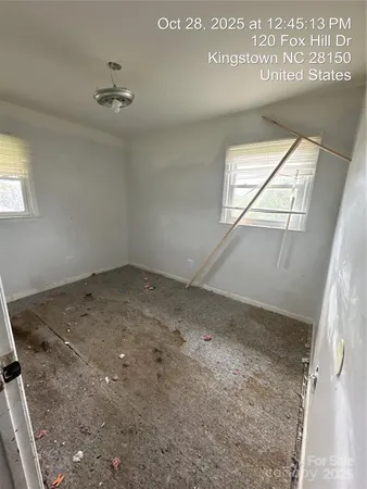 an empty room with windows