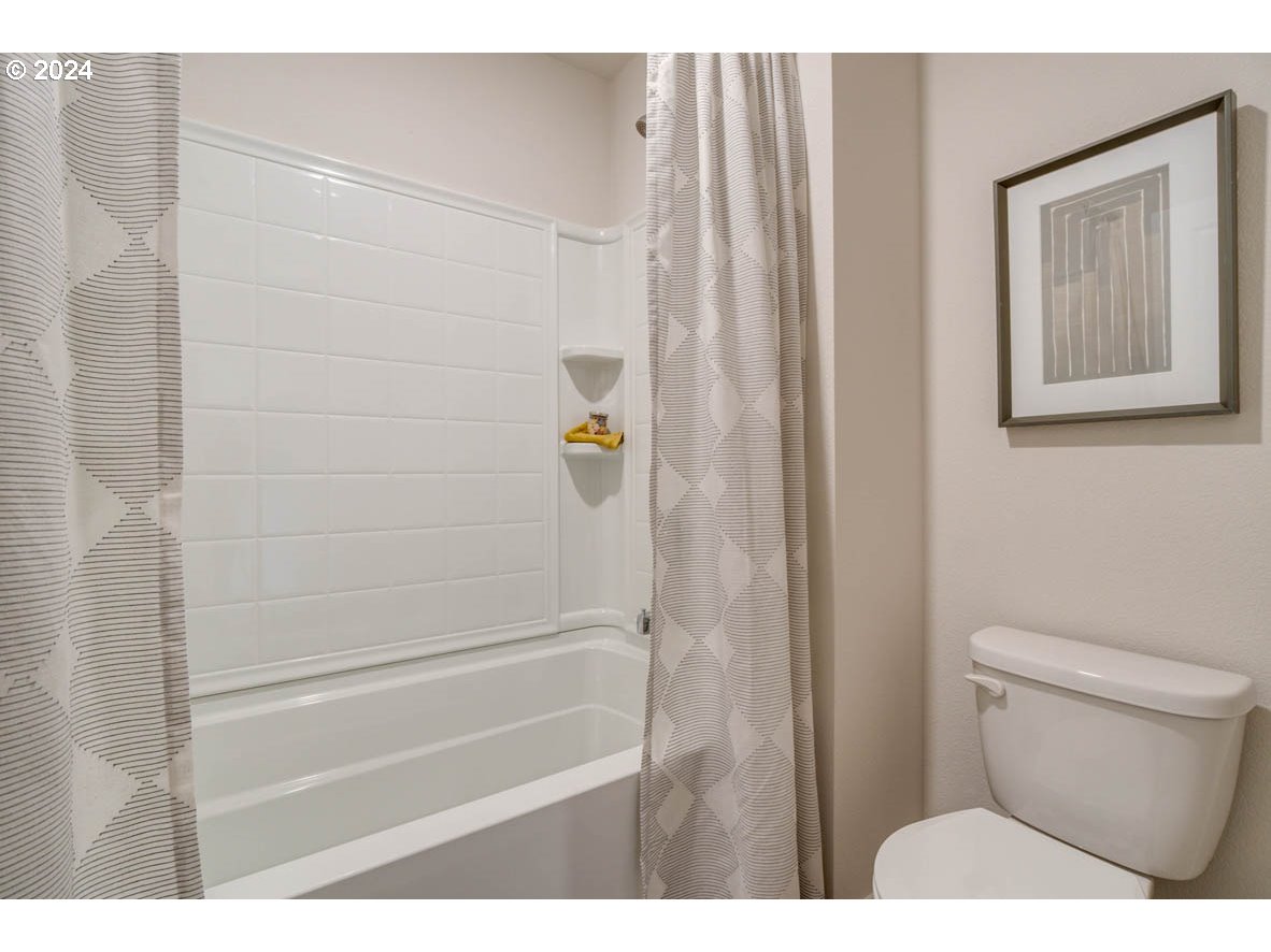 2797 U Street Springfield, OR 97477 - Photo 22 of 29 a bathroom with a toilet and a shower