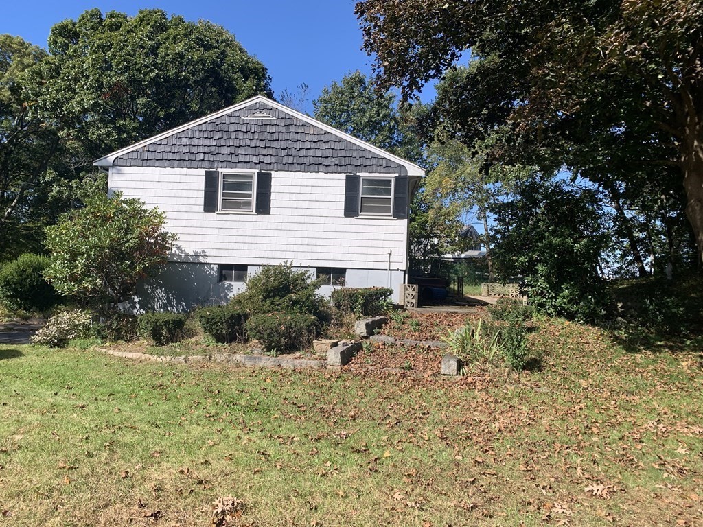 12 Pine Avenue Randolph, MA 02368 - Photo 15 of 18 a view of a house with a yard and sitting area