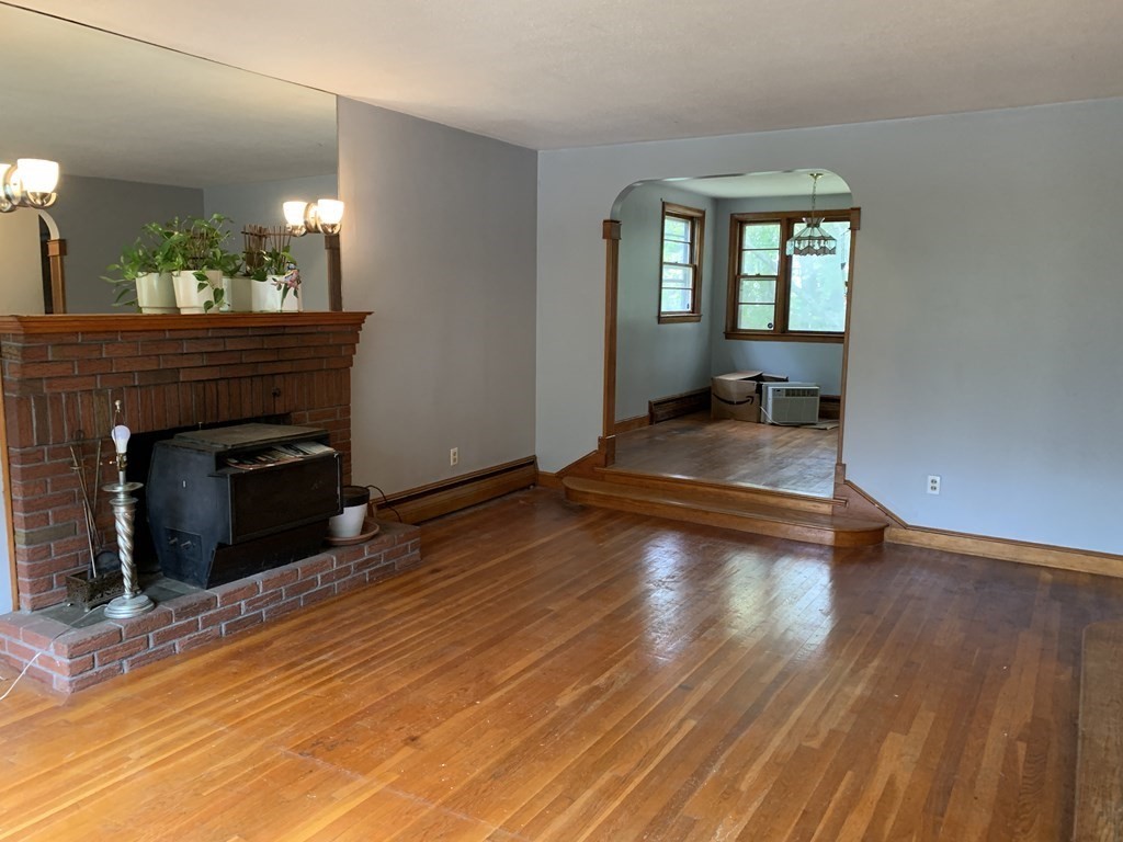 12 Pine Avenue Randolph, MA 02368 - Photo 3 of 18 a view of a room with wooden floor and furniture