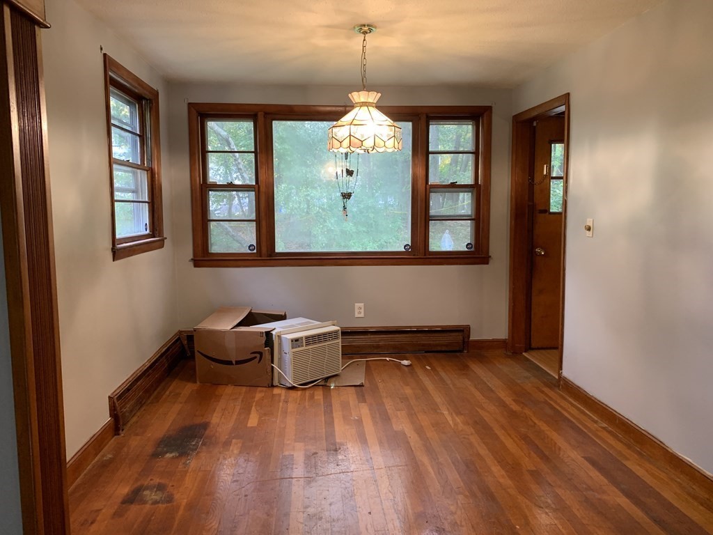 12 Pine Avenue Randolph, MA 02368 - Photo 6 of 18 wooden floor in an empty room with a window