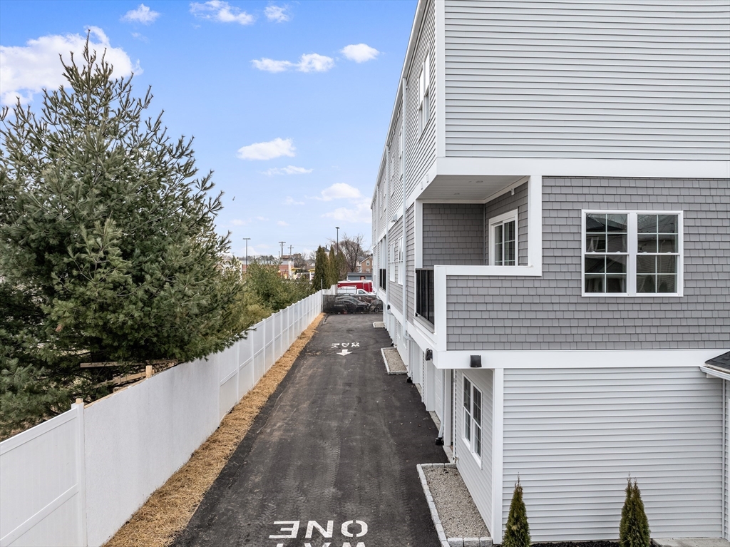 889-895 Grinnell Street, Unit 2 Fall River, MA 02721 - Photo 34 of 38 a view of a house with backyard