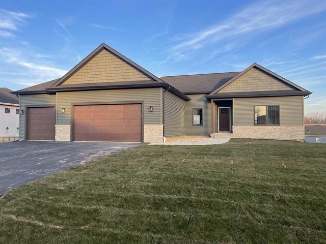 14168 Prairie Commons Lane South Beloit, IL 61080 - Photo 1 of 15 a front view of a house with a yard and garage