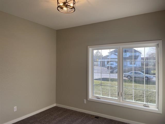 14168 Prairie Commons Lane South Beloit, IL 61080 - Photo 11 of 15 a view of an empty room with a window