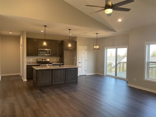 14168 Prairie Commons Lane South Beloit, IL 61080 - Photo 5 of 15 an open kitchen with a refrigerator and a sink