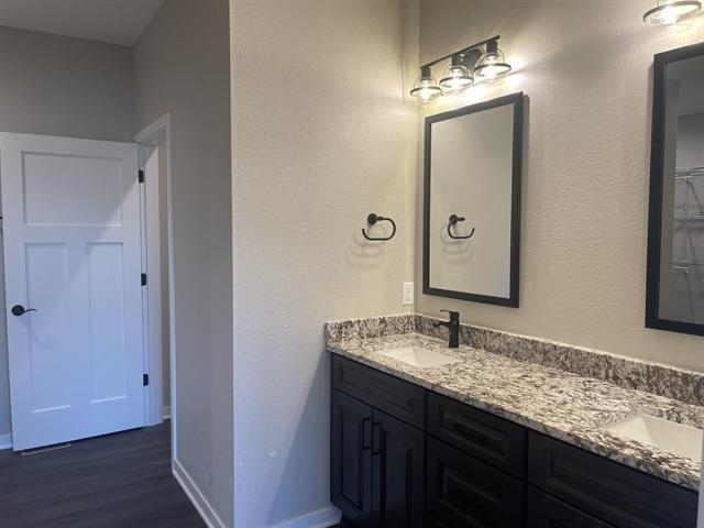 14168 Prairie Commons Lane South Beloit, IL 61080 - Photo 10 of 15 a bathroom with a granite countertop sink and a mirror