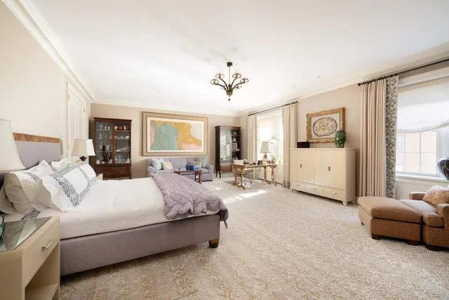 a bedroom with bed and window