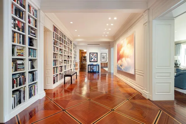 a living room with fireplace furniture and a large window